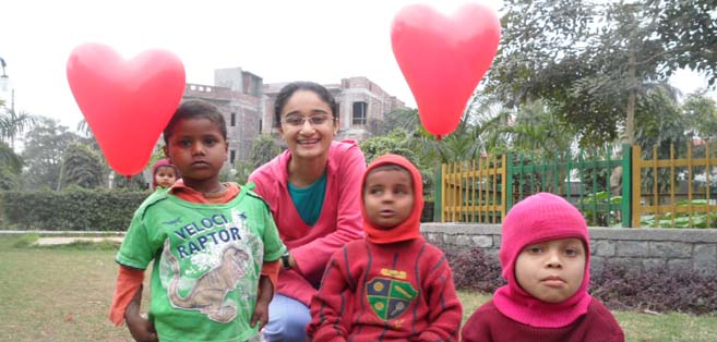 Surinderjit Kaur, volunteer from SRCC celebrating Valentines Day with the kids at Eclair Delhi