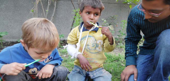 THE FIRST TOOTHBRUSH: Gaurav Poddar, volunteer from St. Stephens conducting a dental hygiene session at Eclair, Delhi